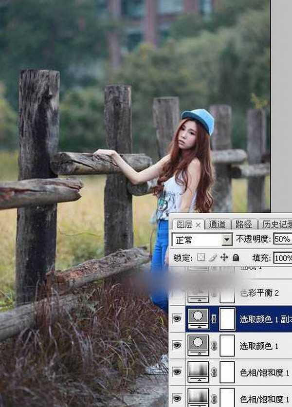 Photoshop为木桩边的美女人物加上高对比蓝黄色效果教程